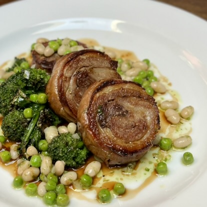 Lamb belly, charred purple sprouting broccoli, white bean, pea and wild garlic dressing